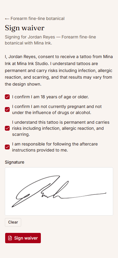 Client signing a tattoo waiver on their phone, with a signature